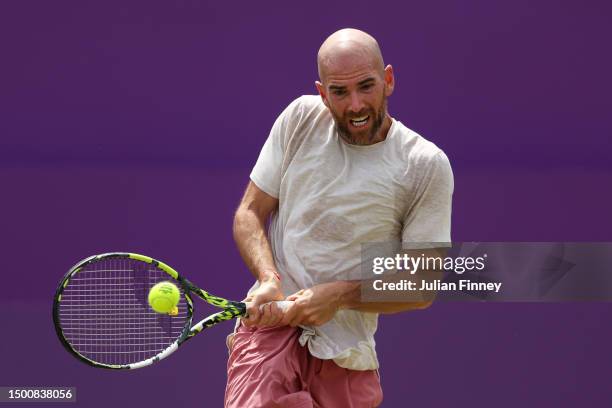 Adrian Mannarino of France plays a backhand against Alex De Minaur of Australia during the Men's Singles Quarter Final match on Day Five of the cinch...