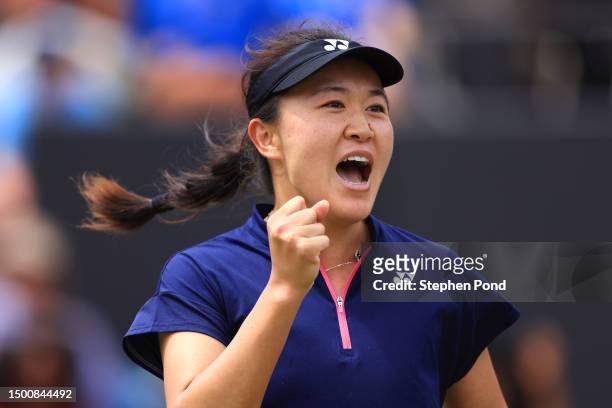 Lin Zhu of China celebrates winning against Rebecca Marino of Canada in the Women's Singles Quarter Final match during Day Seven of the Rothesay...