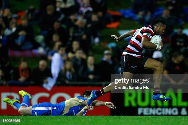 Corey Jane of the All Blacks misses the tackle of Frank Halai of Counties Manukau during a New Zealand All Blacks training match between Counties...