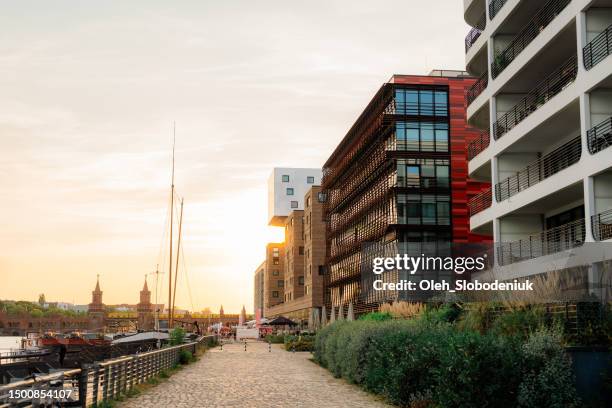 new residential neighbourhood on the background of old architecture in berlin - finance and economy stock pictures, royalty-free photos & images