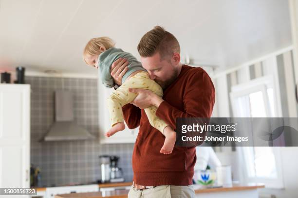 father with toddler with down syndrome - zweden stock pictures, royalty-free photos & images