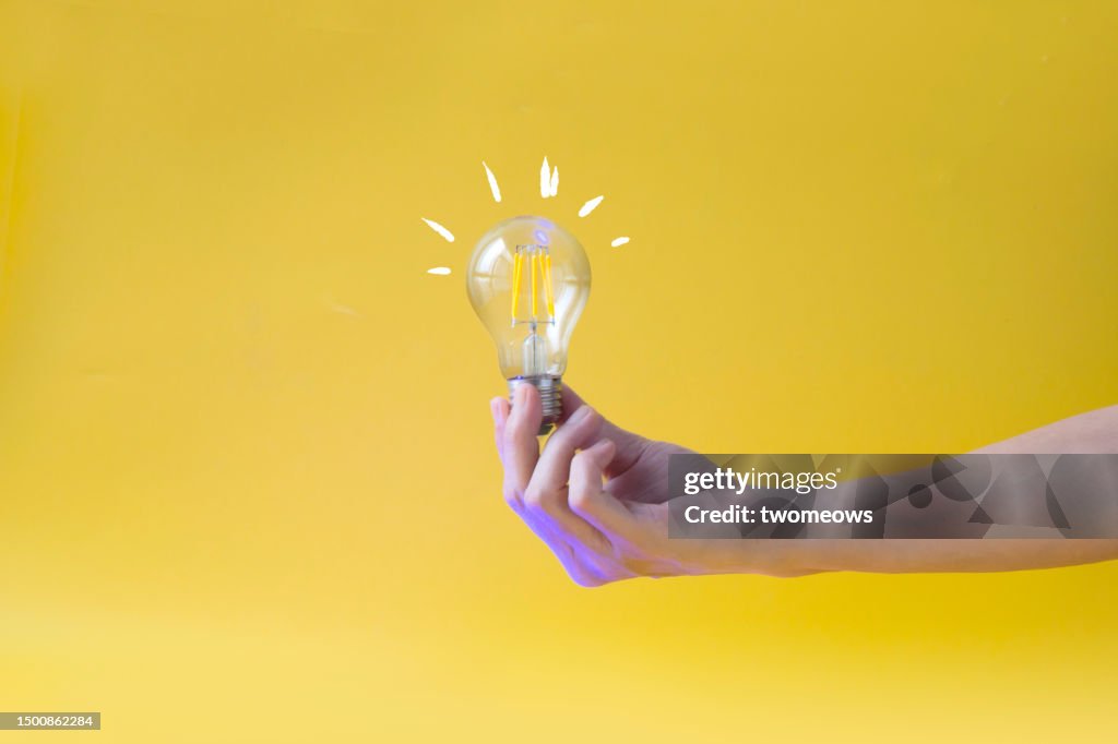 Creative inspiration business or finance still life with light bulb.