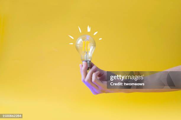 creative inspiration business or finance still life with light bulb. - idé bildbanksfoton och bilder
