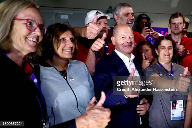 German Chancellor Olaf Scholz and his wife Britta Ernst attend the Handball match between India and Azerbabajian at Horst-Körber-Sportzentrum during...