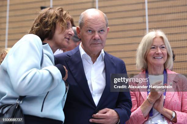 German Chancellor Olaf Scholz and his wife Britta Ernst attend with Mary Davis, CEO of Special Olympics International the Handball match between...