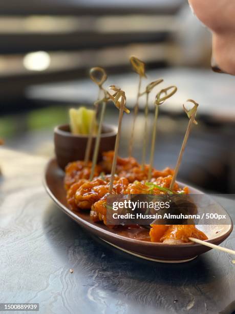 close-up of food in plate on table,manama,capital governorate,bahrain - bahrain business stock pictures, royalty-free photos & images