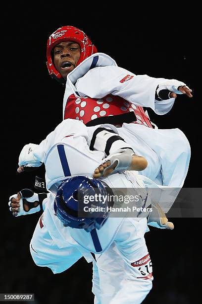 Lutalo Muhammad of Great Britain competes against Farkhod Negmatov of Tajikistan during the Men's -80kg Taekwondo Preliminary Round on Day 14 of the...