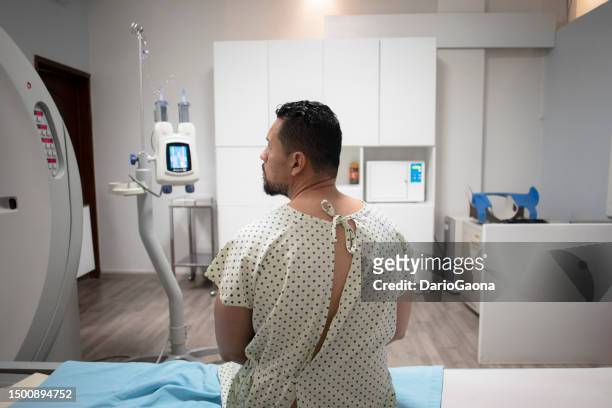 man undergoing a ct scan in a hospital - mexico stock pictures, royalty-free photos & images