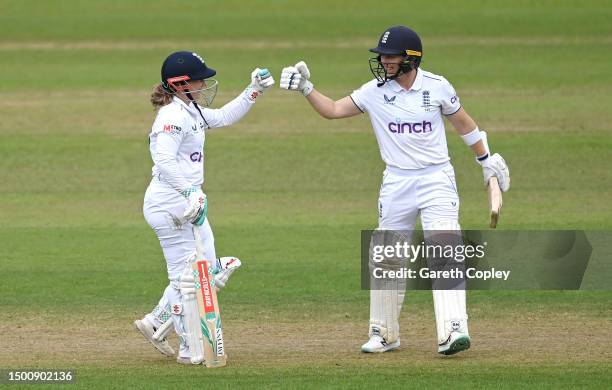 Tammy Beaumont of England celebrates reaches her half century with captain Heather Knight during day two of the LV= Insurance Women's Ashes Test...