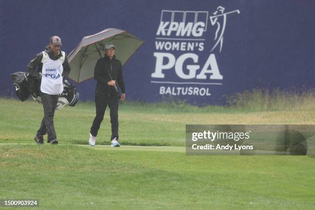 Lee-Anne Pace of South Africa and her caddie walk the 16th fairway during the second round of the KPMG Women's PGA Championship at Baltusrol Golf...