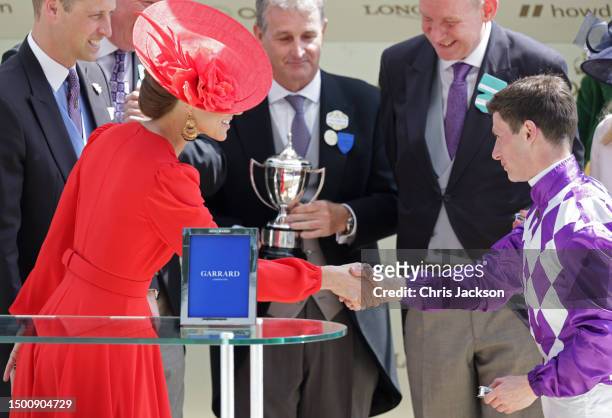 Prince William, Prince of Wales and Catherine, Princess of Wales present Oisin Murphy with the Commonwealth Cup on day four of Royal Ascot 2023 at...