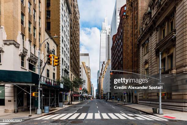 city street in midtown manhattan with one vanderbilt skyscraper on the right, new york, usa - boulevard stock-fotos und bilder