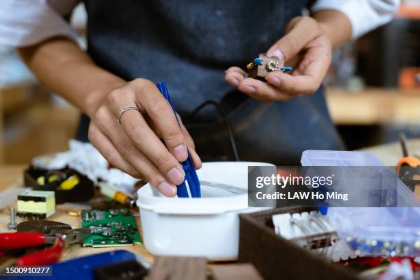 a man making a handicraft - east asian works of art specialist stock pictures, royalty-free photos & images