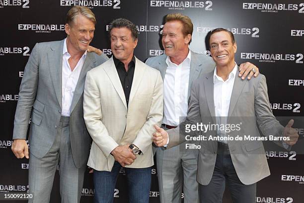 Dolph Lundgren, Sylvester Stallone, Arnold Schwarzenegger and Jean-Claude Van Damme attend 'The Expendables 2' Photocall at Hotel George V on August...