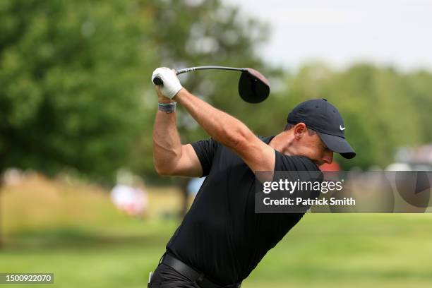 Rory McIlroy of Northern Ireland plays his shot from the seventh tee during the second round of the Travelers Championship at TPC River Highlands on...