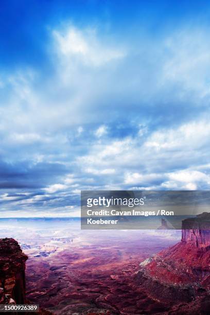 scenic view of storm clouds over the canyonlands national park - koeberer stock pictures, royalty-free photos & images
