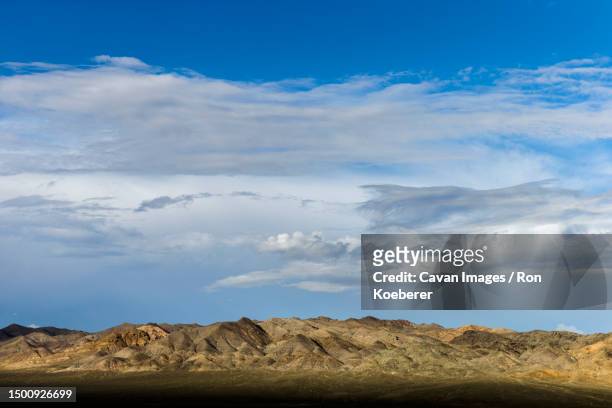 clouds, basin and range along hwy 50 in nevada - koeberer stock pictures, royalty-free photos & images