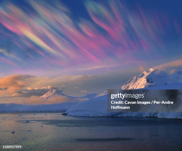 mother of pearl clouds (nacreous clouds), polar stratospheric clouds. these clouds indicate global warming - antarctica sunset stock pictures, royalty-free photos & images