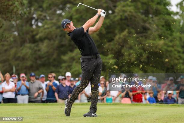 Rory McIlroy of Northern Ireland plays his shot from the fifth tee during the second round of the Travelers Championship at TPC River Highlands on...