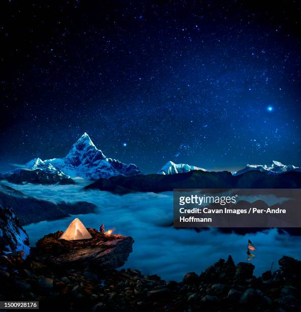 starry sky over camper at bonfire overlooking sea of clouds and mountains, pokhara, kaski, nepal - lagerfeuer stock pictures, royalty-free photos & images