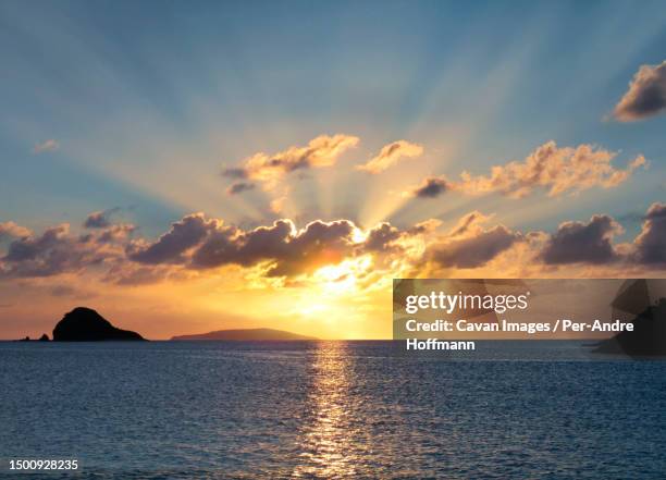 sunset over sea, calaguas islands, camarines norte, philippines - sonnenstrahlen stock pictures, royalty-free photos & images