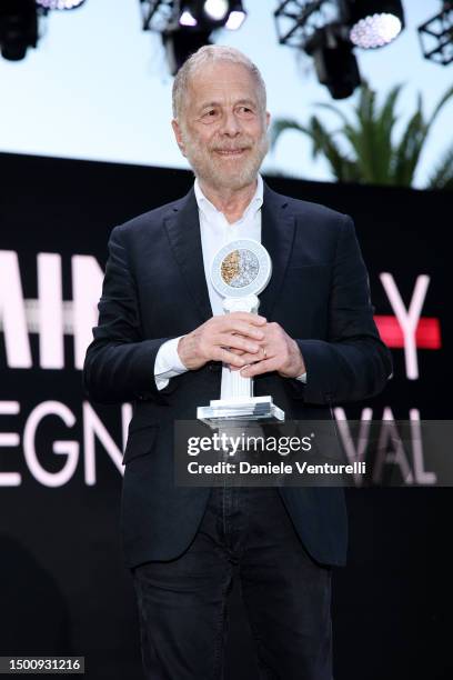 Gabriele Lavia poses with the award during the Filming Italy 2023 on June 23, 2023 in Santa Margherita di Pula, Italy.