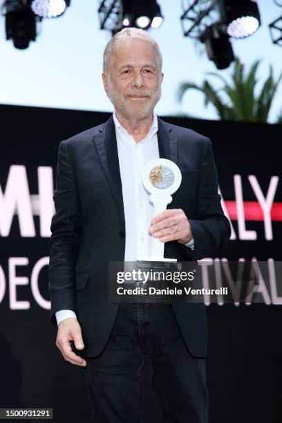 Gabriele Lavia poses with the award during the Filming Italy 2023 on June 23, 2023 in Santa Margherita di Pula, Italy.