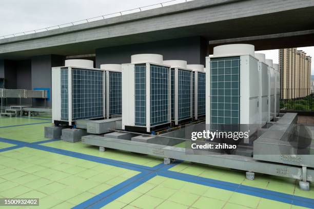 air conditioners on the roof - chillar stock pictures, royalty-free photos & images