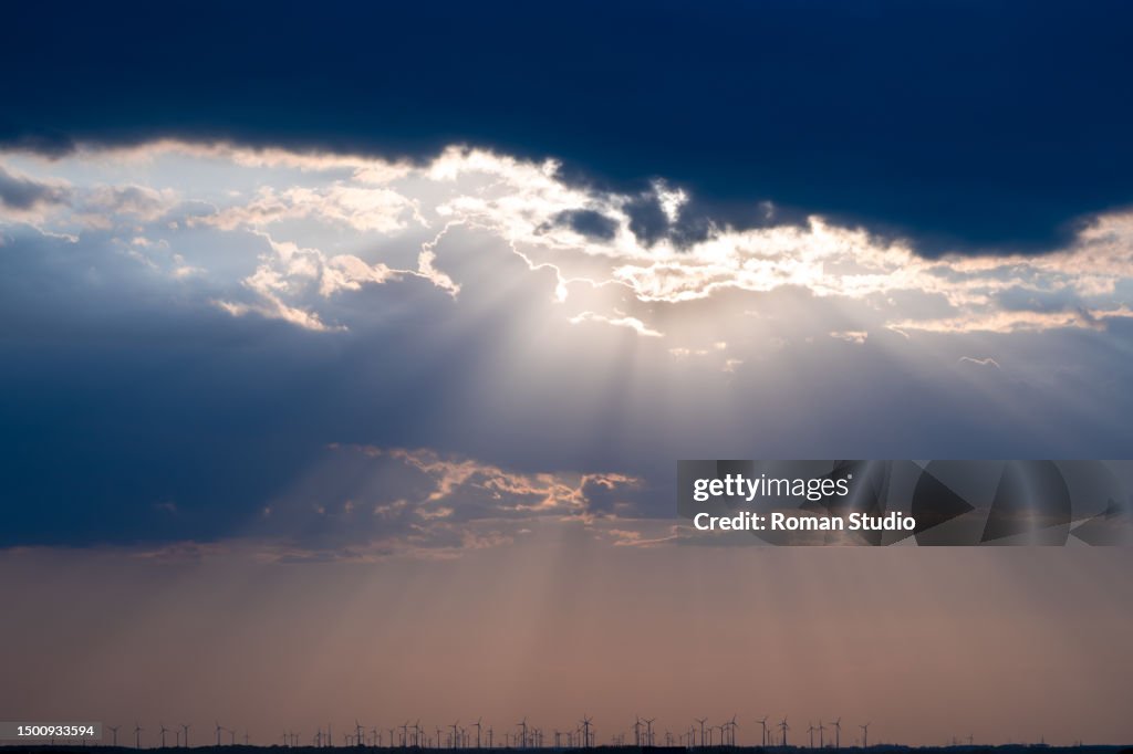 Rays of light shining through dark clouds. God rays. Sun Rays