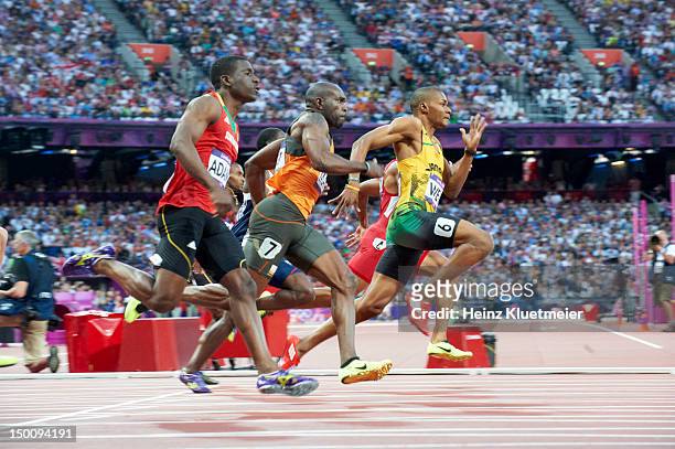 Summer Olympics: Saint Kitts and Nevis Antoine Adams, Netherlands Churandy Martina, and Jamaica Warren Weir in action during Men's 200M Semifinals at...