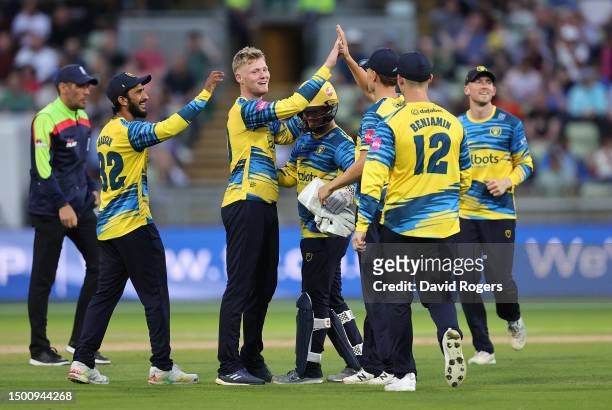 Dan Mousley of Birmingham Bears celebrates with team mates after taking the wicket of during the Vitality Blast T20 match between Birmingham Bears...