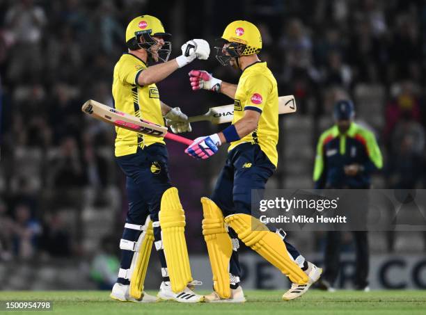 Liam Dawson and Benny Howell of Hampshire celebrate victory at the end of the Vitality Blast T20 between Hampshire Hawks and Essex Eagles at Ageas...