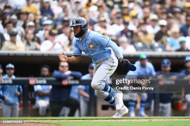 Manuel Margot of the Tampa Bay Rays sets up a slide at home plate during a baseball game against the San Diego Padres at Petco Park on June 18, 2023...