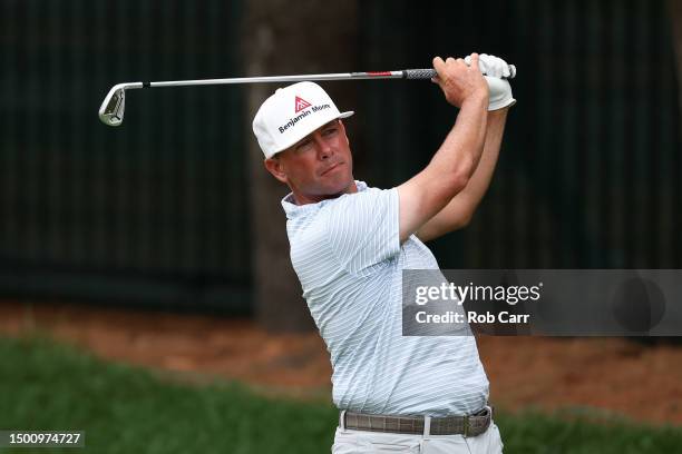 Chez Reavie of the United States watches his shot from the eighth tee during the second round of the Travelers Championship at TPC River Highlands on...