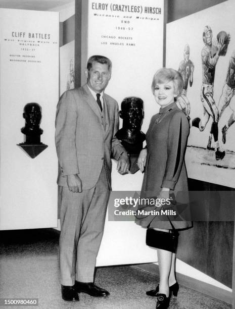 Parade Marshalls, Former football star Elroy Crazylegs Hirsch and American comedienne, actress, singer and businesswoman Edie Adams stand next to...