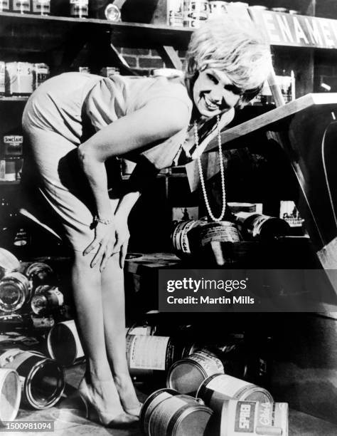 In this United Artist handout, American comedienne, actress, singer and businesswoman Edie Adams smiles in the film room on the set of the American...