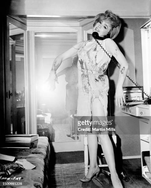 In this United Artist handout, American comedienne, actress, singer and businesswoman Edie Adams talks on the telephone in her dressing room on the...