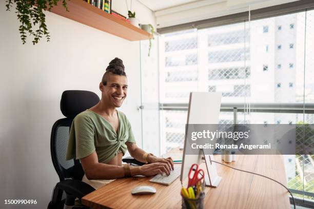 latin transgender woman working from home - hot desking stock pictures, royalty-free photos & images