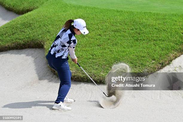 Aya Kinoshita of Japan hits out from a bunker on the 2nd hole during the third round of Earth Mondahmin Cup at Camellia Hills Country Club on June...