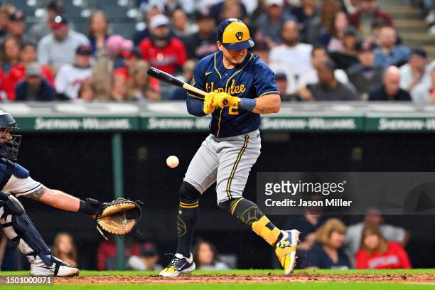 Luis Urias of the Milwaukee Brewers is hit by a pitch during the sixth inning against the Cleveland Guardians at Progressive Field on June 23, 2023...