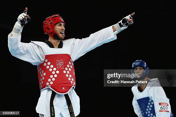 Mauro Sarmiento of Italy celebrates beating Ramin Azizov of Azerbaijan during the Men's -80kg Taekwondo quarterfinal on Day 14 of the London 2012...