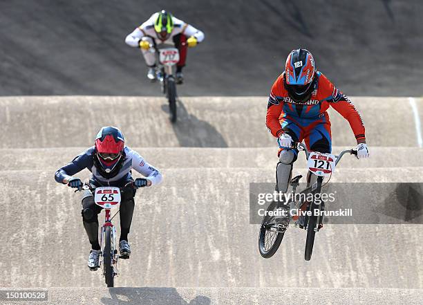 Liam Phillips of Great Britain and Raymon van der Biezen of the Netherlands in action during the Men's BMX Cycling Quarter finals on Day 14 of the...