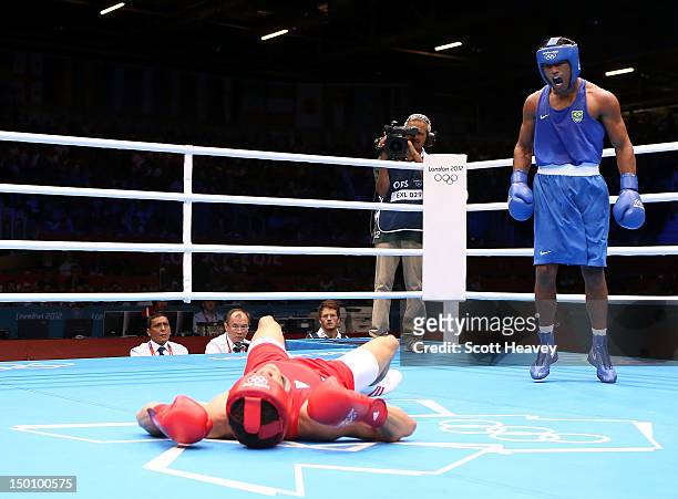 Esquiva Falcao Florentino of Brazil reacts after he knocked down Anthony Ogogo of Great Britain during their Men's Middle Boxing bout on Day 14 of...