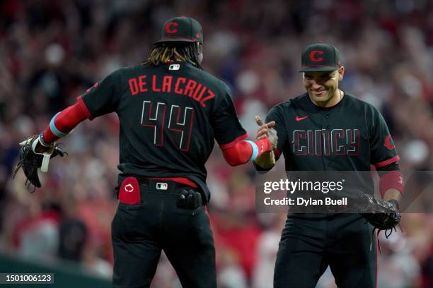 Elly De La Cruz and Joey Votto of the Cincinnati Reds celebrate after beating the Atlanta Braves 11-10 at Great American Ball Park on June 23, 2023...