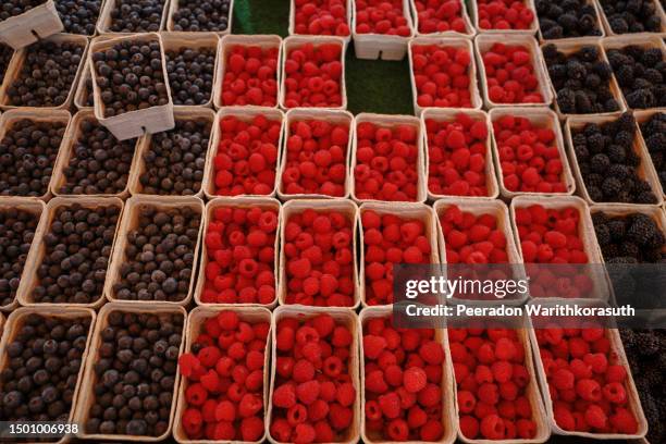 berry and cherry in the boxes are sold at the storefront of stall - mixing stock pictures, royalty-free photos & images