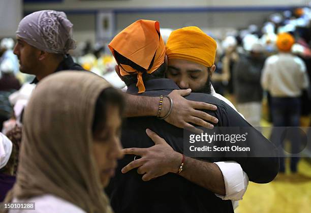 Family and friends gather at Oak Creek High School to mourn the loss of 6 members of the Sikh Temple of Wisconsin on August 10, 2012 in Oak Creek,...