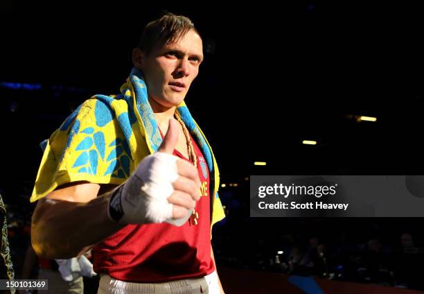 Oleksandr Usyk of Ukraine reacts after he was declared the winner against Tervel Pulev of Bulgaria during their Men's Heavy Boxing bout on Day 14 of...