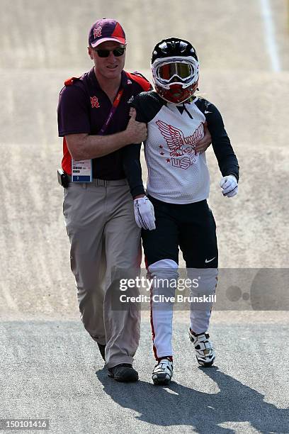 Alise Post of the United States is assisted by medical crew after a crash in the Women's BMX Cycling Semi Finals on Day 14 of the London 2012 Olympic...