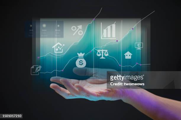 palm supporting an uptrend chart against a black background with financial icons. - man double exposure profit concept stock pictures, royalty-free photos & images