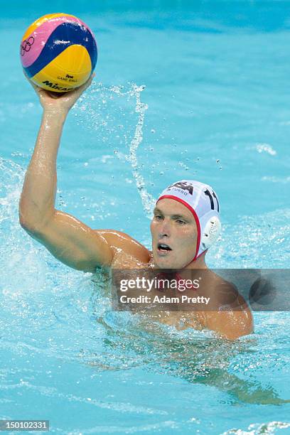 Jesse Smith of United States throws a pass in the Men's Water Polo Semifinal 5-8 match between the United States and Spain on Day 14 of the London...